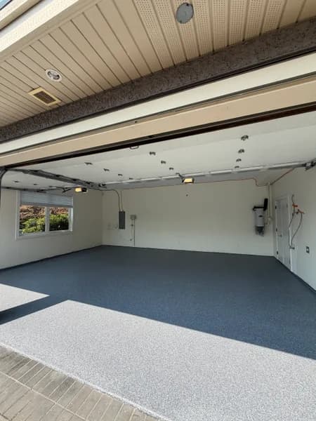 Wide view of a Basalt flake epoxy three-car garage floor in Richmond, BC