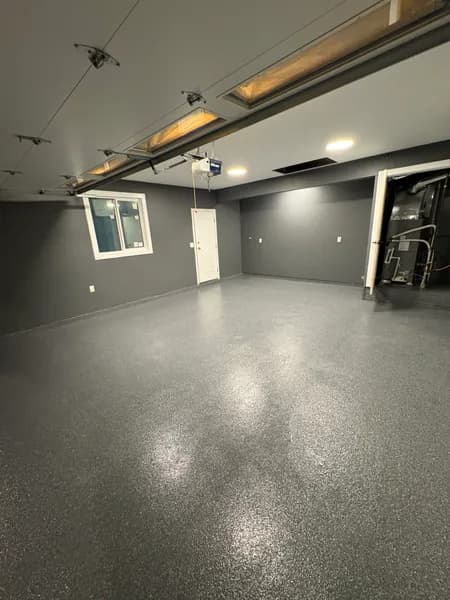Glossy Basalt flake epoxy garage floor with grey walls in Surrey, BC