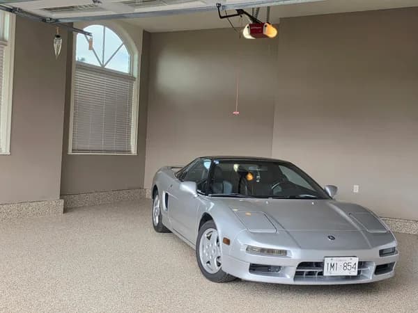 Silver sports car parked on a Bean flake epoxy garage floor in Aldergrove, BC