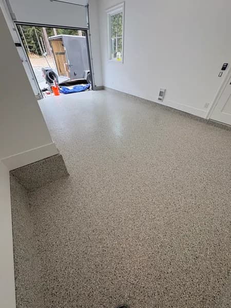 Cabin Fever flake epoxy floor by the garage entry step in Langley, BC