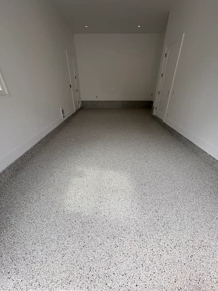 Cabin Fever flake epoxy floor in a tandem garage bay in Langley, BC