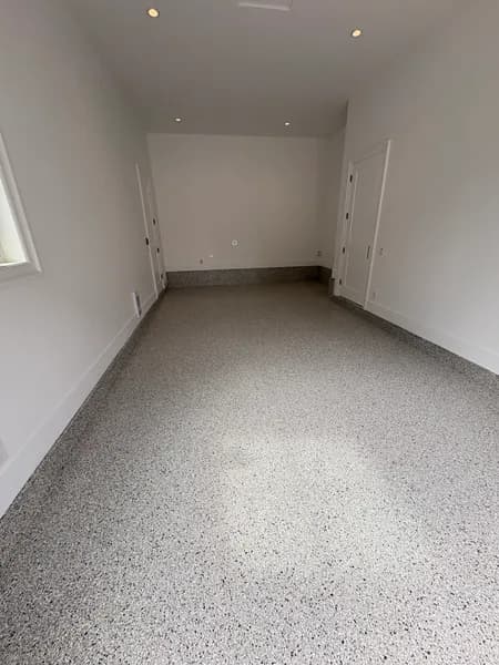Bright Cabin Fever flake epoxy garage floor with white walls in Langley, BC