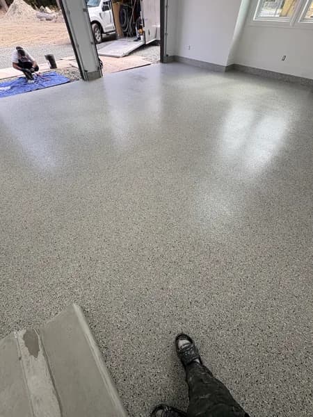 Low-angle view of a Cabin Fever flake epoxy garage floor in Langley, BC