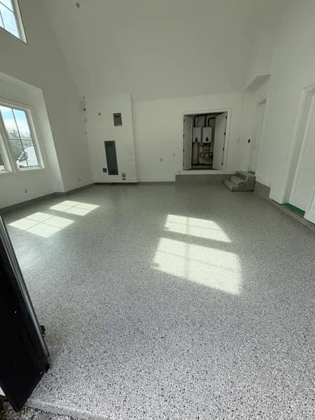 Cabin Fever flake epoxy garage floor with sunlight from the windows in Langley, BC