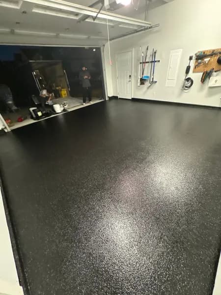 Wide view of a Carbon flake epoxy garage floor in Delta, BC