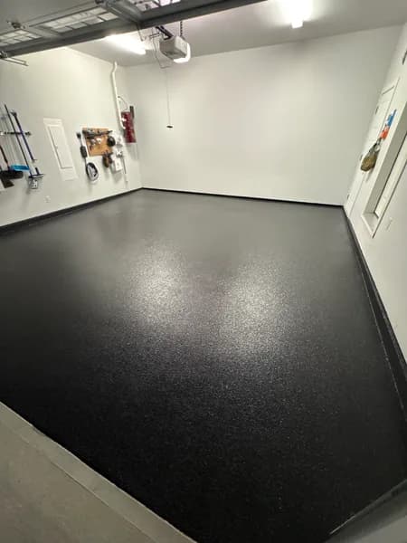 High-gloss Carbon flake epoxy garage floor with bike storage in Delta, BC