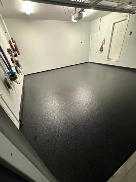 Carbon flake epoxy garage floor with wall storage in Delta, BC