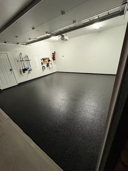 Corner view of a Carbon flake epoxy garage floor in Delta, BC