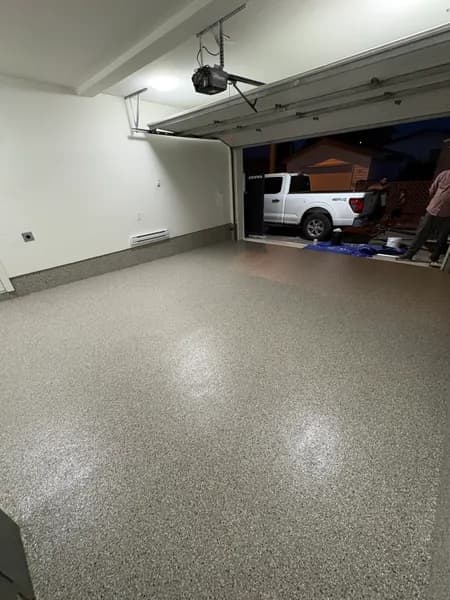 Creek Bed flake epoxy garage floor with a pickup truck outside in Vancouver, BC