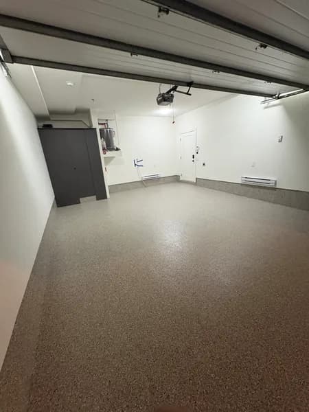 Wide view of a Creek Bed flake epoxy garage floor in Vancouver, BC