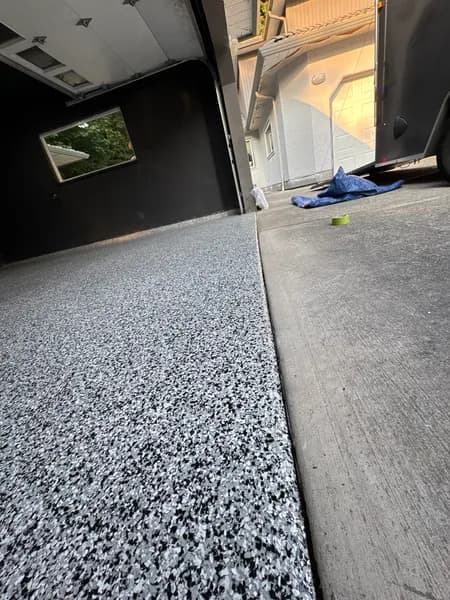 Domino flake epoxy garage floor at the driveway edge in Squamish, BC