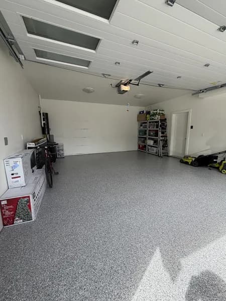 Light grey flake epoxy floor in a tidy two-car residential garage