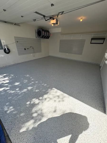 Wide view of a Gracious flake epoxy garage floor with cove base in Langley, BC