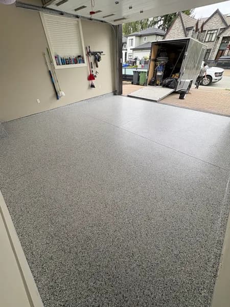 Gravel flake epoxy garage floor looking out to the driveway in Richmond, BC