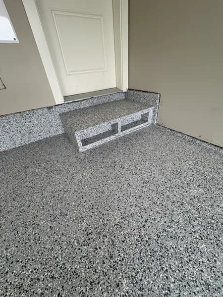 Gravel flake epoxy floor and coated storage bench in a Richmond garage