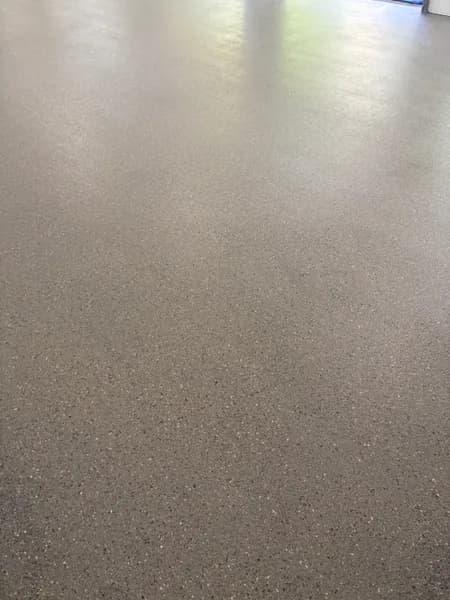 Close-up of a hybrid flake epoxy garage floor finish in West Vancouver, BC