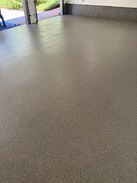 Smooth hybrid flake epoxy garage floor surface in West Vancouver, BC