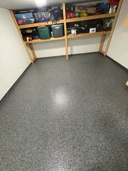 Nightfall flake epoxy floor in a storage room with shelving in Port Coquitlam, BC