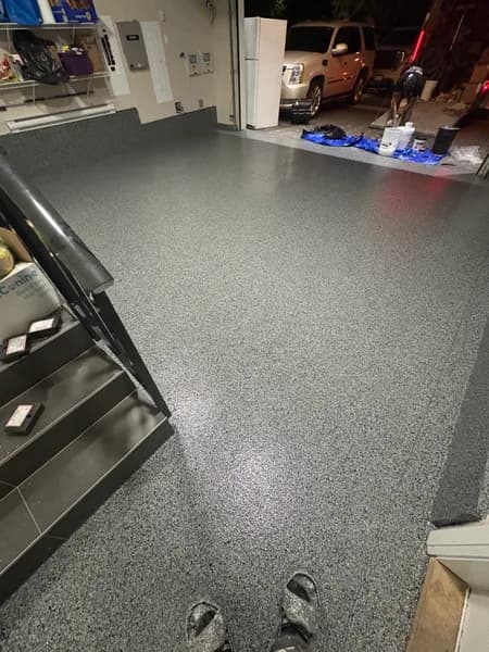 Nightfall flake epoxy garage floor next to entry stairs in North Delta, BC