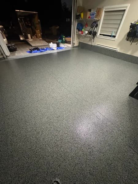 Glossy Nightfall flake epoxy garage floor at night in North Delta, BC
