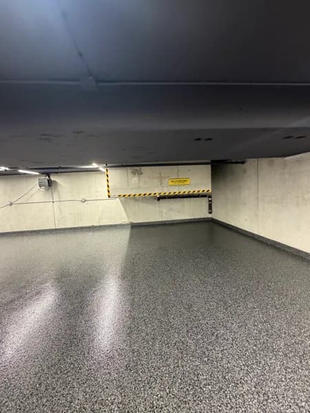 Wide view of a Nightfall flake epoxy parking garage floor in Vancouver, BC