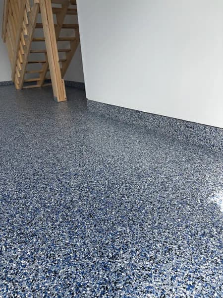 Orbit flake epoxy floor and cove base by the garage stairs in Maple Ridge, BC