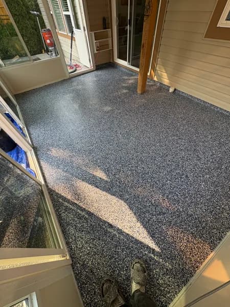 Close-up of Orbit flake epoxy on a covered patio in Chilliwack, BC