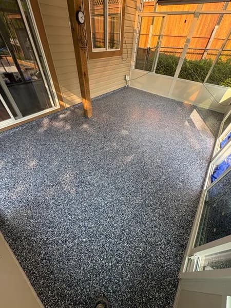 Orbit flake epoxy sunroom patio floor with wood posts in Chilliwack, BC