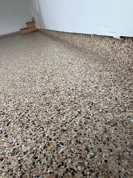Close-up of Outback flake epoxy texture in a Surrey garage