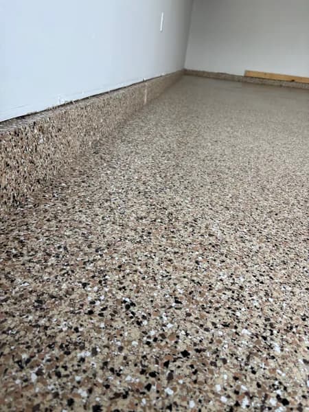 Close-up of Outback flake epoxy along the garage wall in Surrey, BC