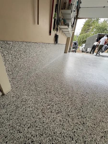 Low-angle view of a Quicksilver flake epoxy garage floor in Chilliwack, BC