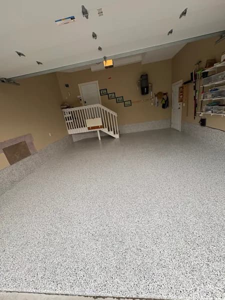 Quicksilver flake epoxy garage floor with wall storage in Chilliwack, BC