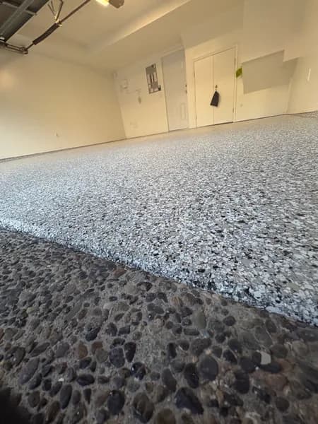 Quicksilver flake epoxy garage edge beside an aggregate driveway in Richmond, BC