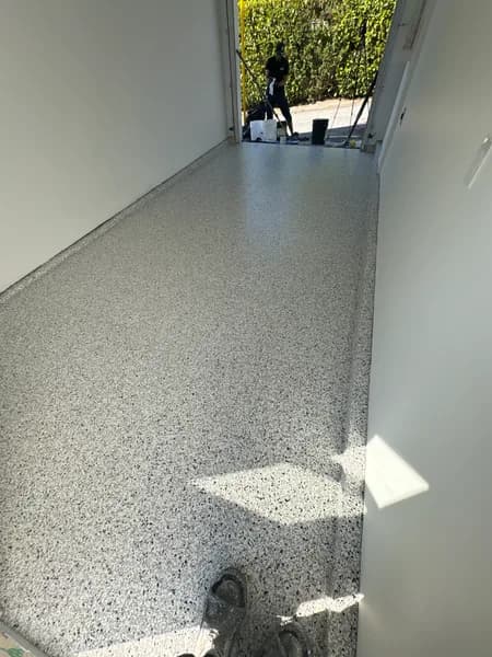 Sunlit Quicksilver flake epoxy one-car garage floor in Vancouver, BC