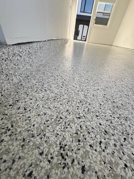 Close-up of Quicksilver flake epoxy texture in a Vancouver garage