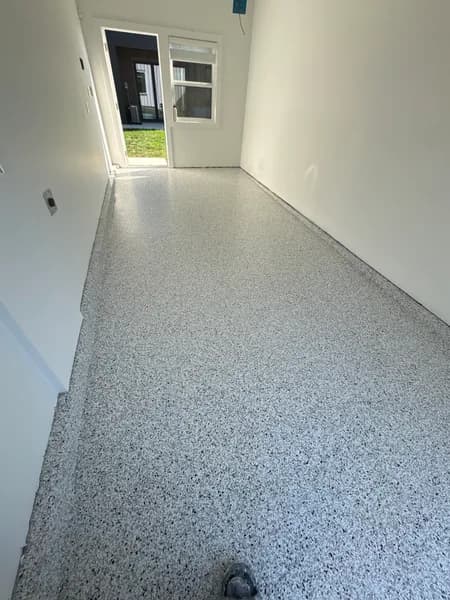 Finished Quicksilver flake epoxy floor in a one-car garage in Vancouver, BC