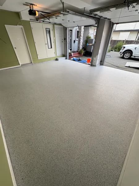Schist flake epoxy garage floor by the entry door in White Rock, BC