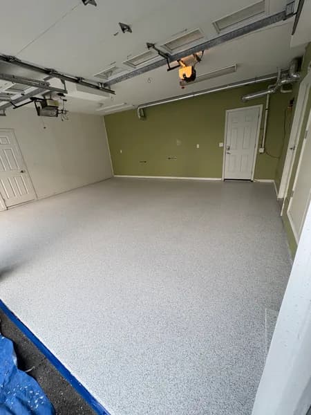 Schist flake epoxy garage floor with green accent walls in White Rock, BC