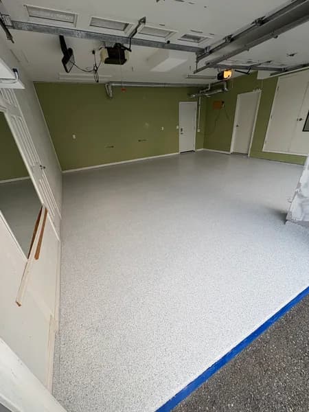 Wide view of a Schist flake epoxy two-car garage floor in White Rock, BC