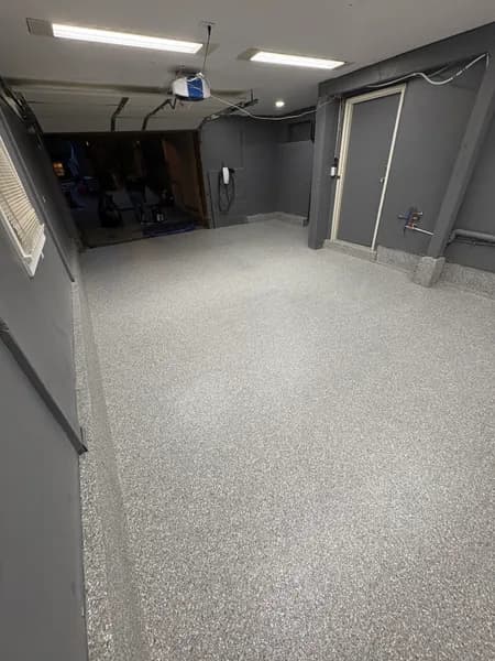Stoney Creek flake epoxy floor looking toward the garage door in North Vancouver, BC