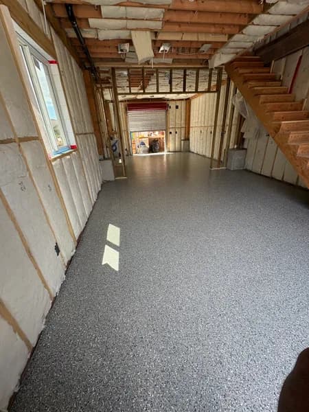 Thyme flake epoxy floor with wood stairs in Vancouver, BC
