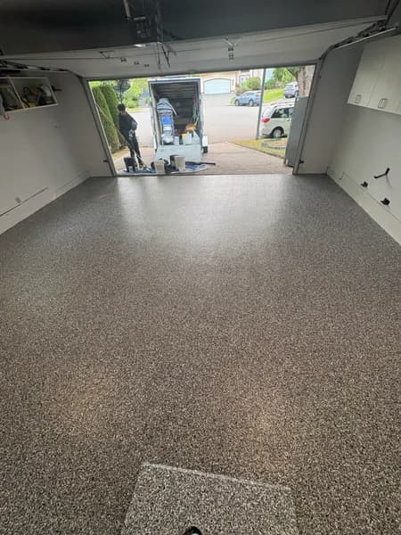 Wombat flake epoxy garage floor looking out to the driveway in Richmond, BC