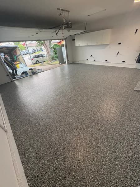 Wombat flake epoxy floor in a two-car garage in Richmond, BC