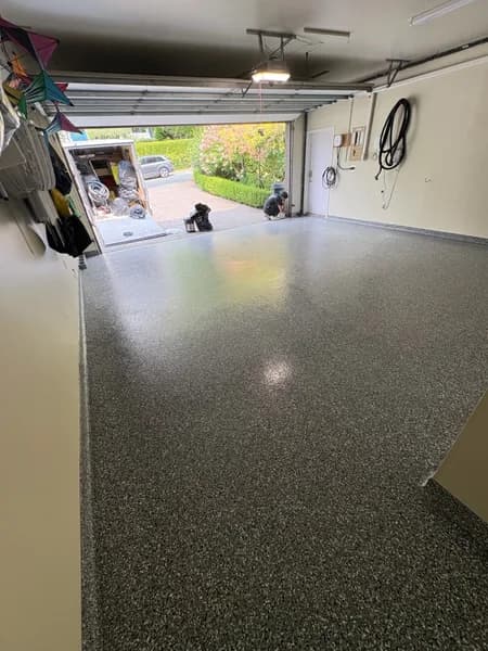 Wombat flake epoxy garage floor looking out to the driveway in West Vancouver, BC