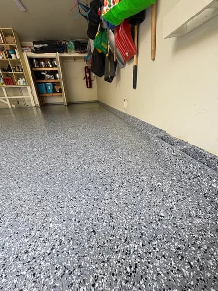 Close-up of Wombat flake epoxy texture in a West Vancouver garage