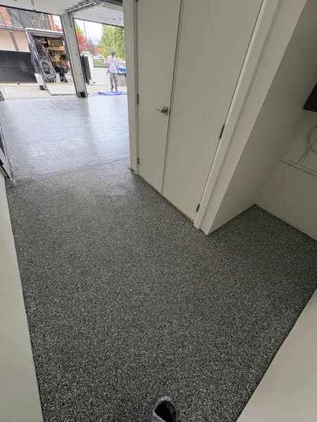 Corner view of a Wombat flake epoxy garage floor in White Rock, BC