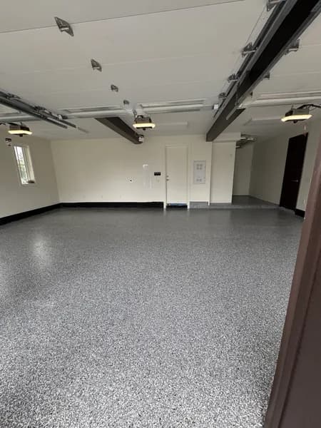 Finished Wombat flake epoxy floor in a large three-car garage in White Rock, BC