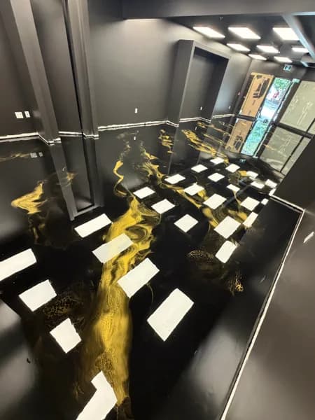 Mirror-like black and gold metallic epoxy retail floor in downtown Vancouver