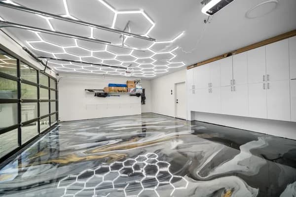 Metallic epoxy garage floor with gold and grey swirl finish installed by Go2Epoxy