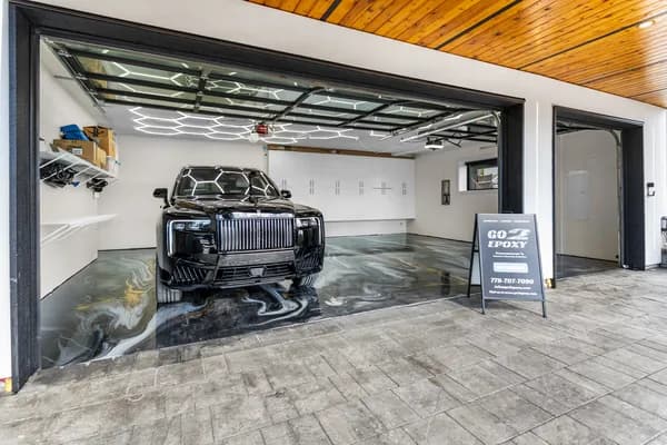 Metallic epoxy showroom floor with seamless high-gloss surface by Go2Epoxy